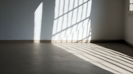 Empty room with light from window and shadow on the wall and floor