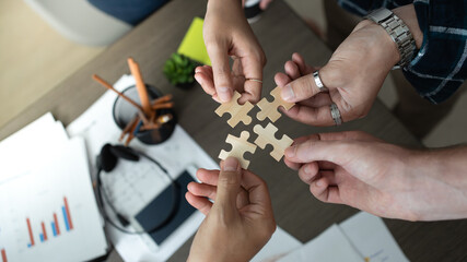 Hand holding jigsaw puzzles, Business partnership concept. Businesswoman hand connecting jigsaw...