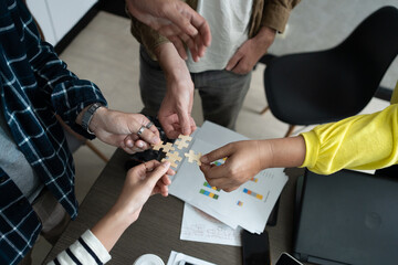 Hand holding jigsaw puzzles, Business partnership concept. Businesswoman hand connecting jigsaw puzzle.