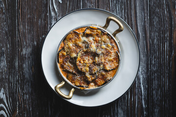 Lasagne on wooden texture background