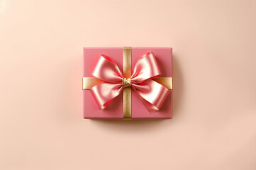A beautiful pink gift box with a shiny ribbon on a beige background. Top view, copy space