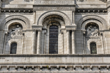 Paris Basilica Sacre Coeur at top of Montmartre - Roman Catholic Church and minor basilica, dedicated to Sacred Heart of Jesus. Paris, France.