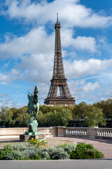 Fototapeta na wymiar Eiffel tower with Statue of La France Renaissante, Paris, France