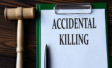 ACCIDENTAL KILLING - words on a white sheet with a judge's gavel - obrazy, fototapety, plakaty