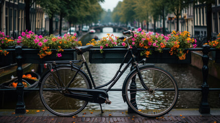 Fototapeta na wymiar a bicycle is parked next to a railing with flowers on it and a canal in the background in a city.
