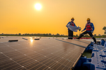 Fototapeta premium Male workers repair Floating solar panels on water lake. Engineers construct on site Floating solar panels at sun light. clean energy for future living. Industrial Renewable energy of green power.