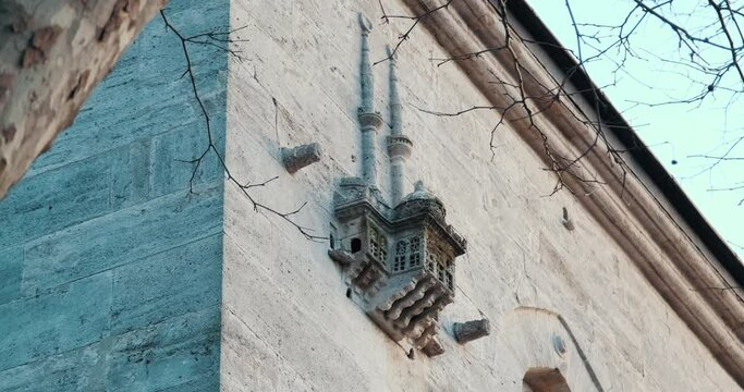 Cute bird's nest on the wall of Yeni Valide Mosque. It was built in the form of a mosque with its minaret, dome and body.