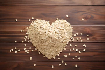 Tuinposter Koffiebar A heart made of oatmeal grains on a brown wooden background.