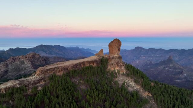 Aerial shot picturesque paradise of Roque Nublo, Flight over of a volcanic rock in caldera of Tejeda, Gran Canaria, Canary islands, Spain.
