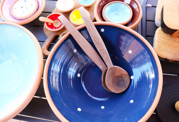 original vintage ceramic dishes on a wooden table at a flea market