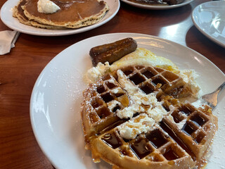 A Waffle Breakfast Partially Eaten