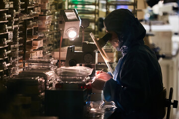 The scientist is carefully working in a secret important laboratory. Infection Laboratory