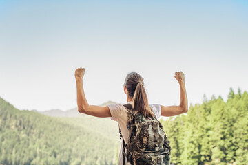 Happy Strong Fit Young Woman with arms raised standing on mountain, Active Healthy Lifestyle...