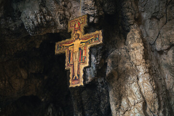 Ancient Crucifix hanging from the top of a cavern 