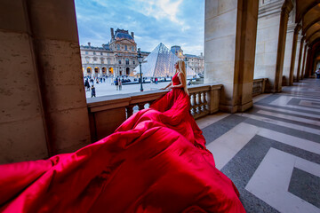 Beautiful pretty blonde woman in red long dress in Paris, France. Eiffel Tower, Louvre,  Galeries...