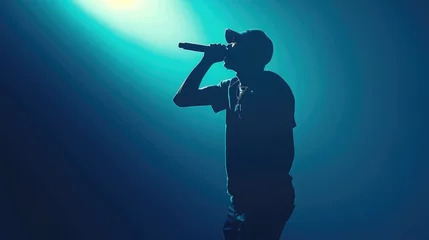 Fotobehang Silhouette of rap singer performing on stage. Bright blue background with hip hop artist performing on concert in night club © buraratn