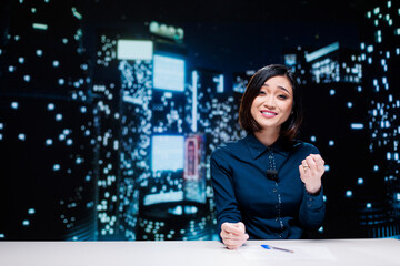 Night show host on live broadcast addressing global news topics from newsroom, discussing about...