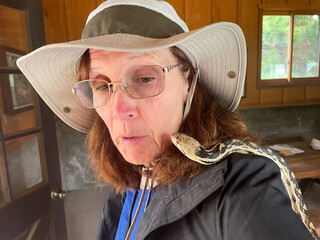 A Mature Woman Naturalist Experiencing a Gopher Snake for the First Time showing ophidiophobia,  The Fear of Snakes