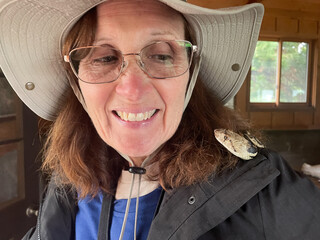 A Mature Woman Naturalist with a Gopher Snake very Happy!