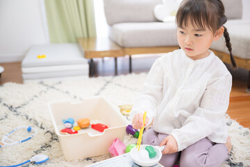 Children playing make-believe and play Imagery of 3-4 year olds at home or in kindergarten