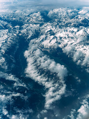 Aerial View of Steep Rocky Snowcapped Mountain Range on Beautiful Sunny Day