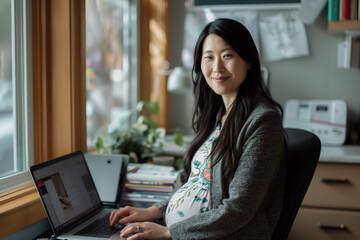 Happy Professional Pregnant Asian Woman Working on Laptop Working from Home Remote