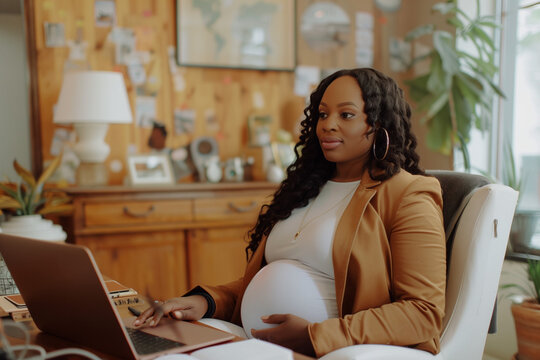 Professional Pregnant Black Woman Working on Laptop Working from Home Remote - Powered by Adobe