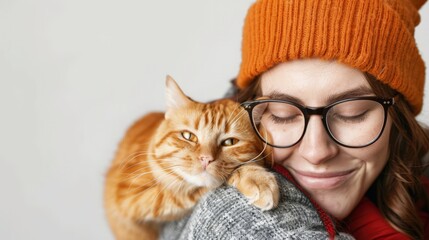 portrait handsome young hipster woman, hugs his good friend ginger cat on white wall background. Positive human emotions, facial expression, feelings. People and animals in love