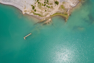 Aerial view of ruins of Roman bath on Yesa reservoir near Tiermas village in Spain, Summer 2023