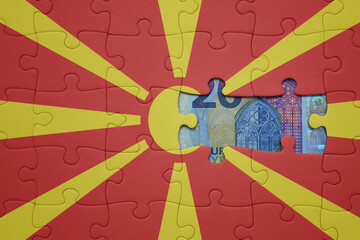 puzzle with the national flag of macedonia and euro banknote. finance concept