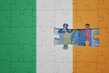 puzzle with the national flag of ireland and euro banknote. finance concept