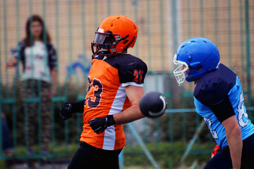 American football players and a passing ball	
