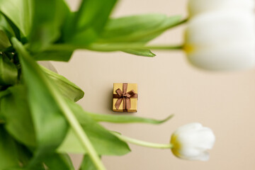 Small Gift Box Amongst White Tulip Petals