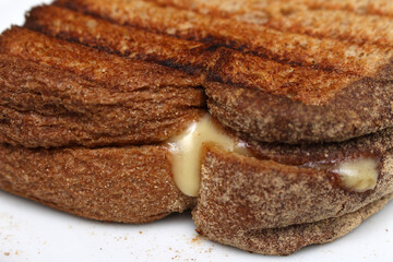 cheese sandwich details. toasted bread with cheese. meal details.