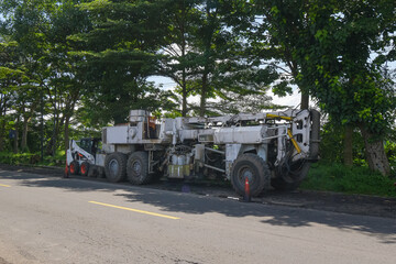 Fototapeta premium Road construction car. Road under construction Asphalt big car