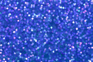 Blue Background with Scattered Iridescent Particles