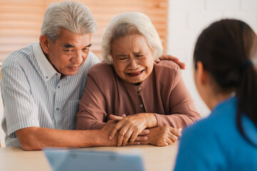 Health insurance service, Young Asian caregiver nurse examine senior man or woman patient at home....