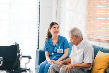 asian woman doctor nursing home to helping take care to retirement patient who sitting on wheelchair, caregiver nurse support to medical health care insurance at home or hospital, elderly senior man