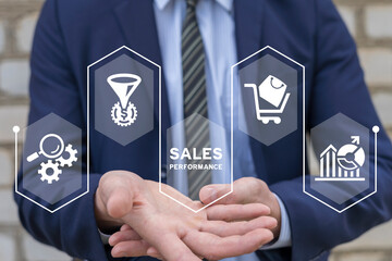 Businessman using virtual interface sees inscription: SALES PERFORMANCE. Sales performance management and report concept. Drive sales performance to optimize window opportunity for sale.
