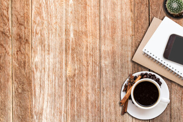 Office desk with coffee cup and smart phone