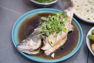 A plate of steamed sea bass