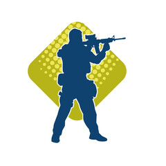 Silhouette of a male soldier carrying machine gun weapon.