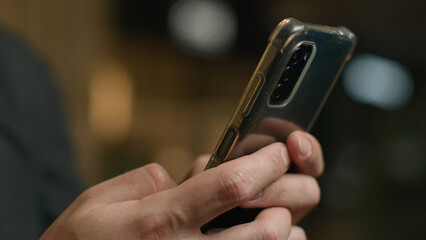 Close-up male hands chatting cellphone screen typing message touchscreen on mobile phone unrecognizable man businessman texting smartphone make online order buy internet purchases using digital apps