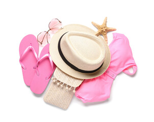 Stylish beach hat, flip flops, bikini bra, sunglasses and starfish on white background