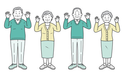 両手を上げる高齢者男女