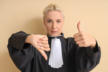 Mature judge showing like and dislike on beige background