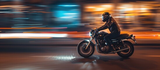 Man night ride motorcycle with blurred light effect on the background - obrazy, fototapety, plakaty