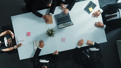 Top down aerial view of professional business team wear vr headset and receive financial data from laptop while use hand gesture to control marketing plan from manager laptop at meeting. Directorate.