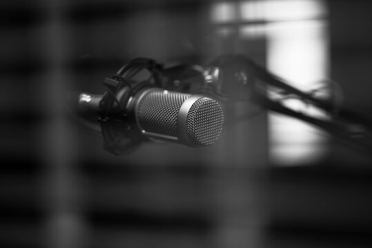 condenser microphone on a boom arm for podcasting