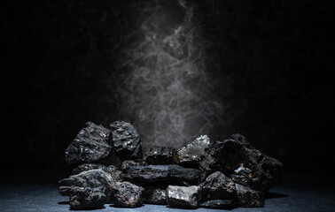 podium made of natural black coal stones for the presentation of cosmetics, jewelry, medicine, skin care, perfumes - 746894481